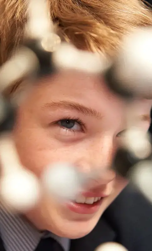 Pupil looking through a model of a molecule