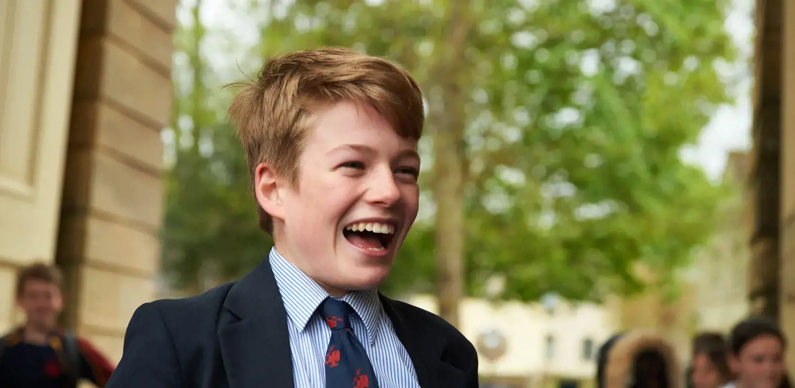 Happy pupil outside Stable Block