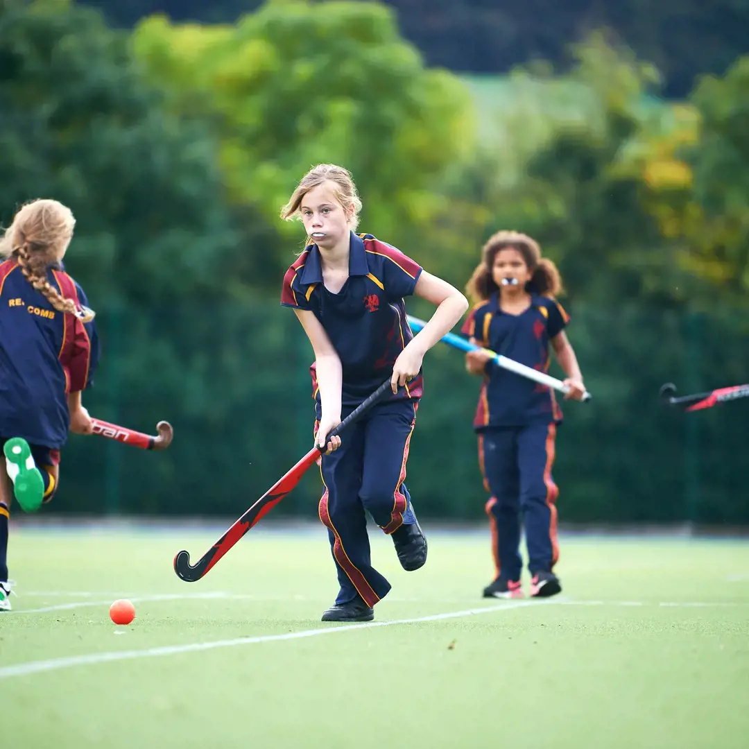 Rendcomb College students playing hockey