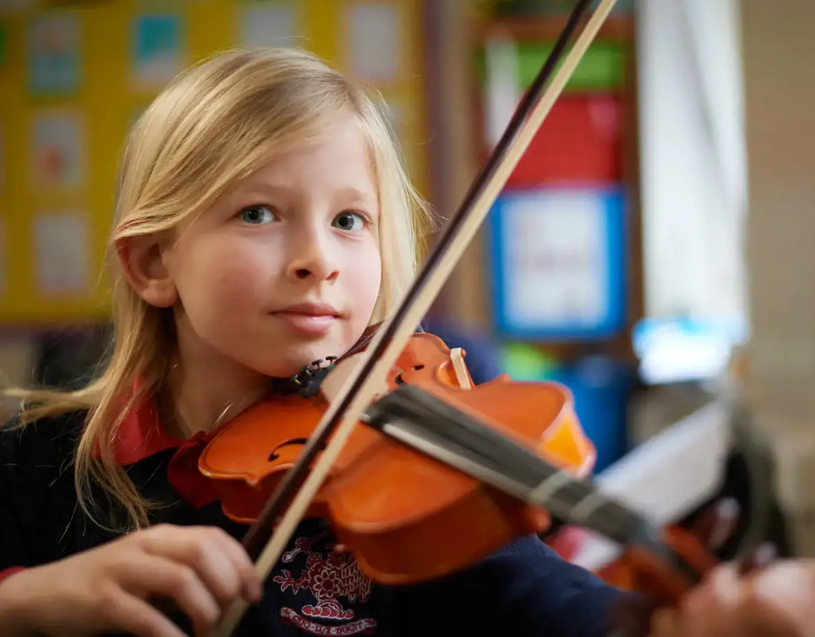 Junior School pupil playing the violin