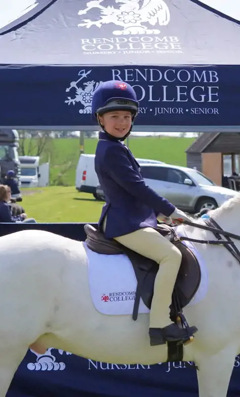 Rendcomb College pupil riding a horse
