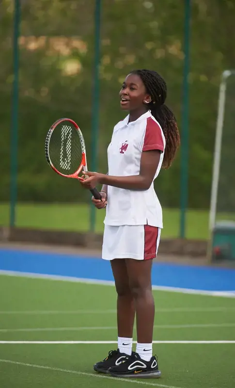 Rendcomb College girl playing tennis
