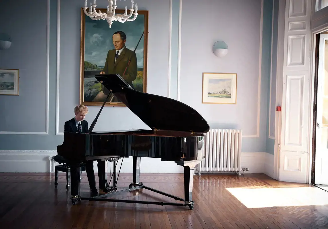 Pupil playing piano