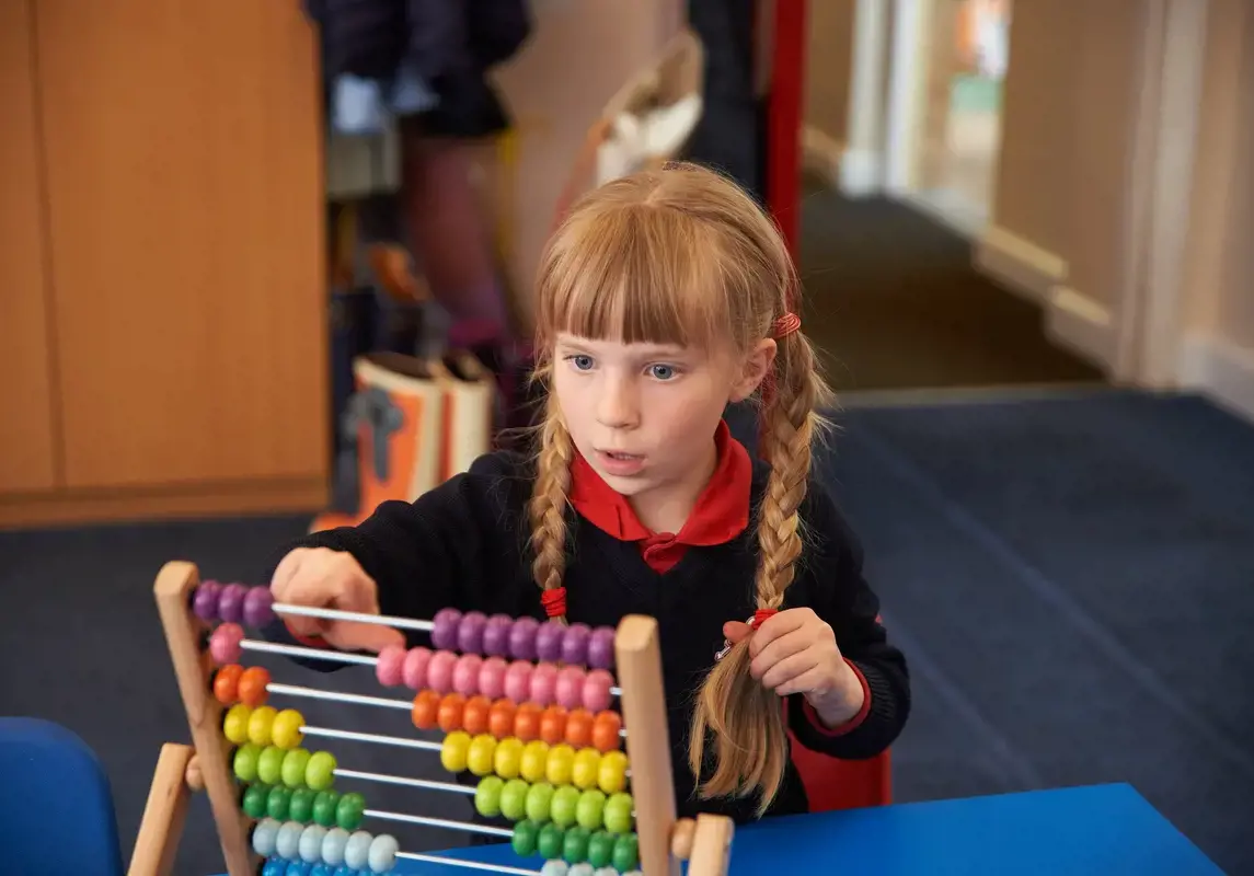 Child using an abacus