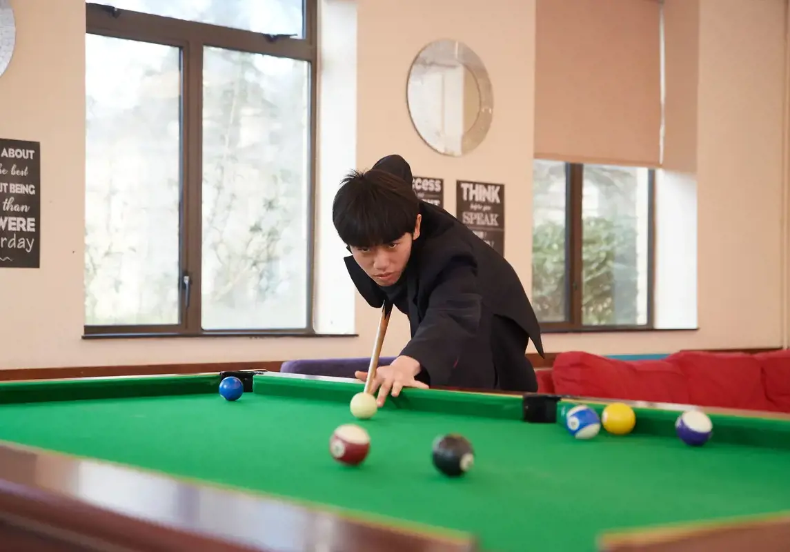 Student playing pool