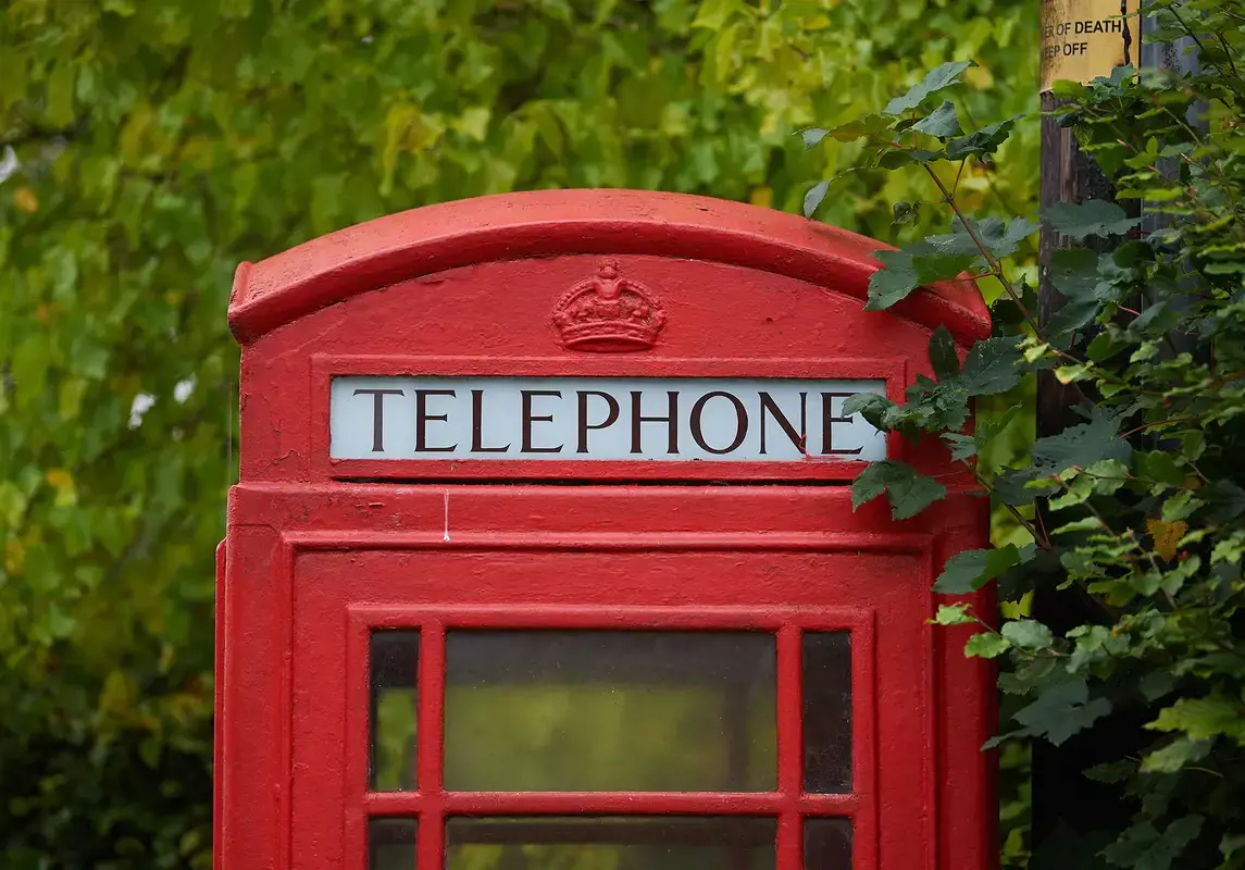 A red telephone box on Rendcomb College's grounds