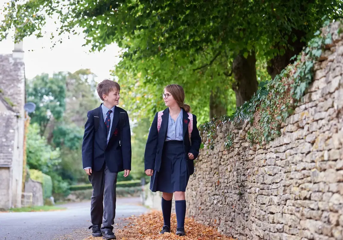 Students walking in Rendcomb College's grounds