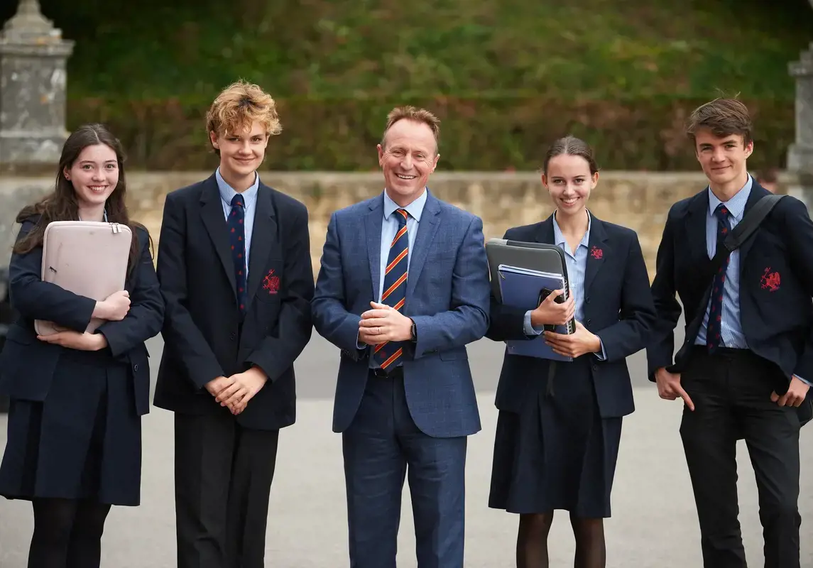 Rendcomb College headteacher with pupils