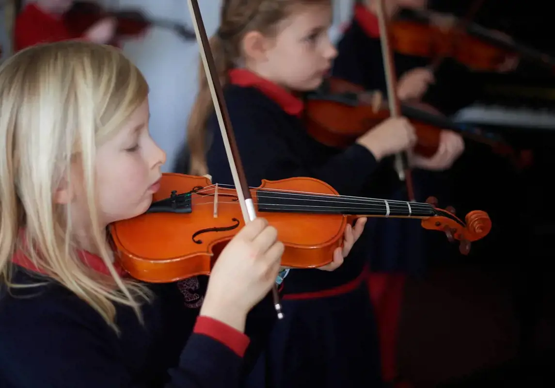 Rendcomb College pupil playing violin