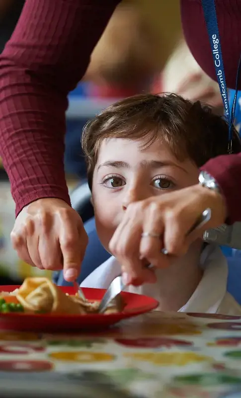 Young boy eating lunch