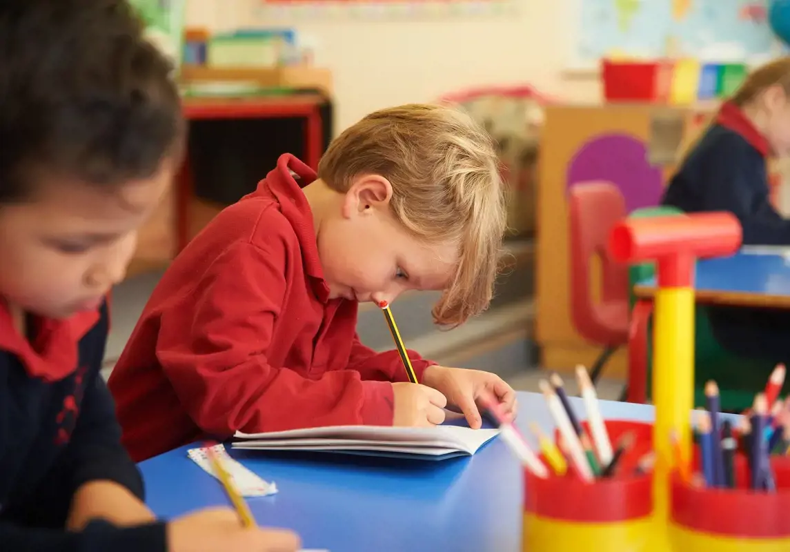 Nursery pupil working hard