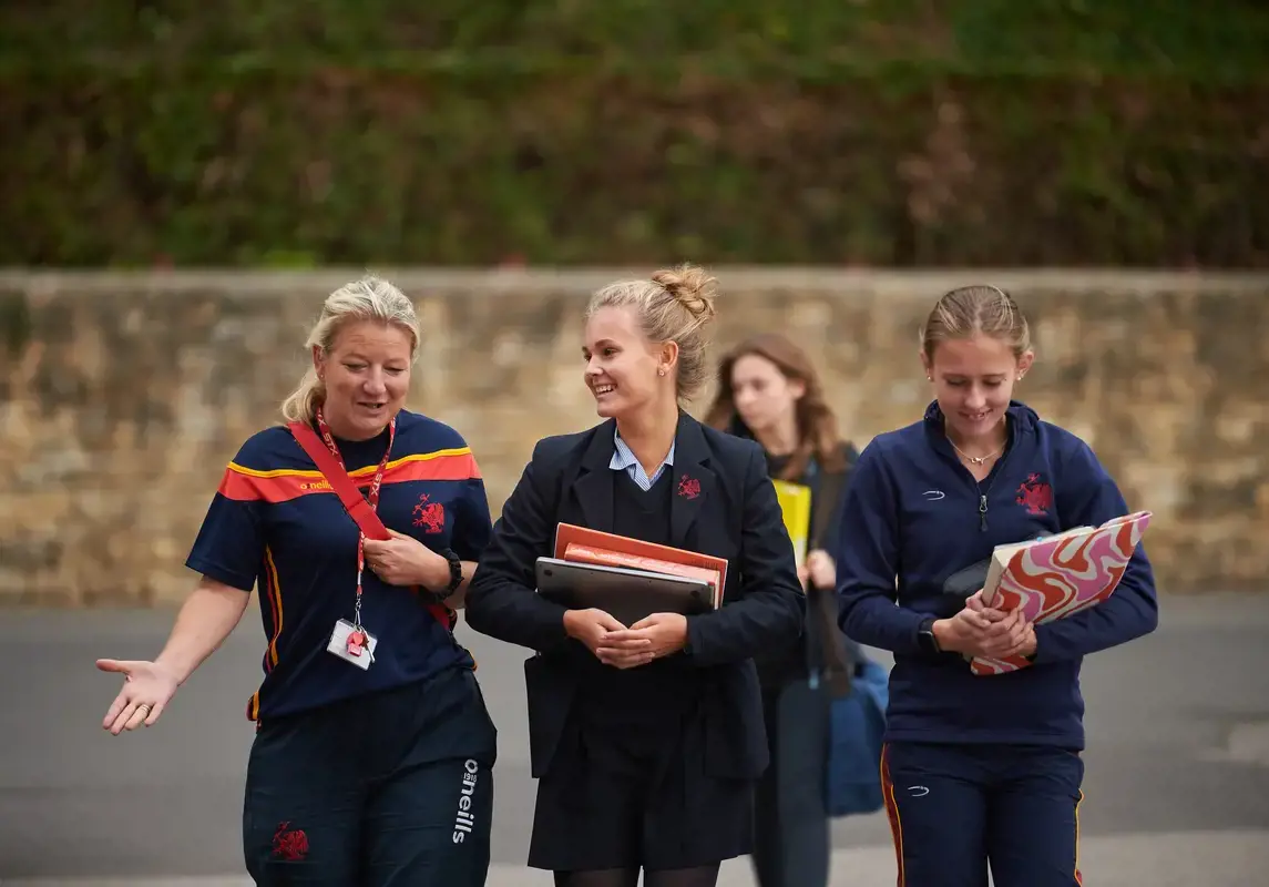 Rendcomb College pupil chatting with a teacher