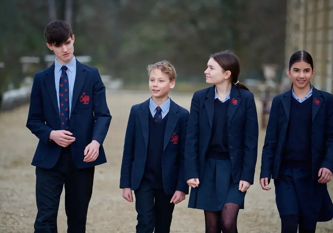 A group of pupils walking in the school grounds