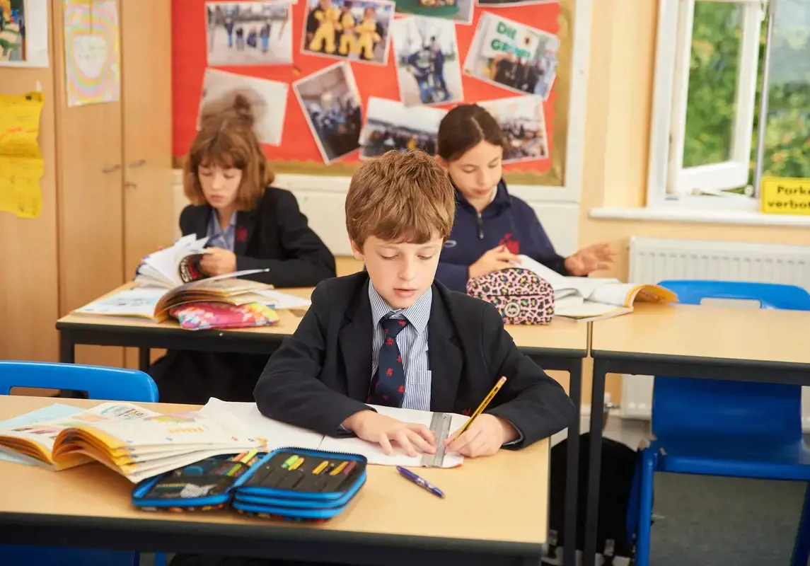 Boy working in classroom