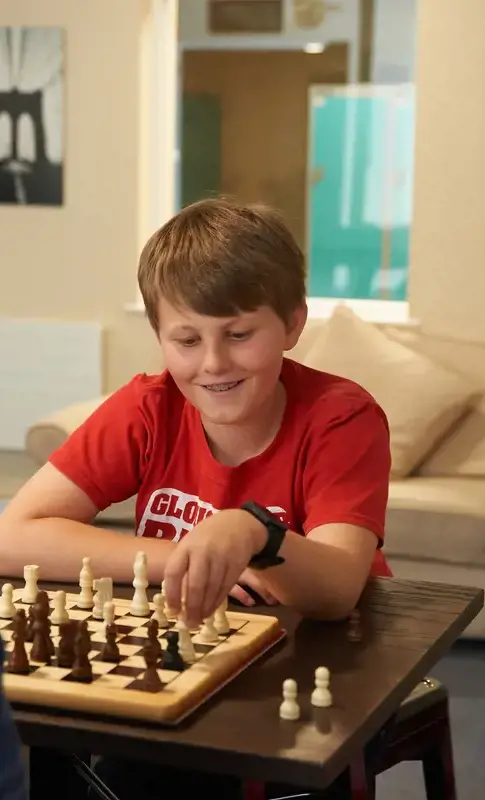 Rendcomb College pupil playing chess