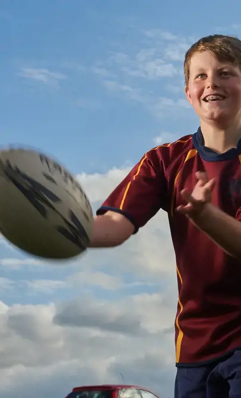 Rendcomb boy catching a rugby ball