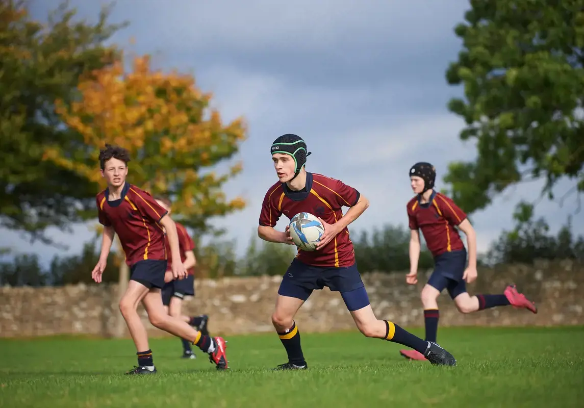 Rendcomb College students playing rugby