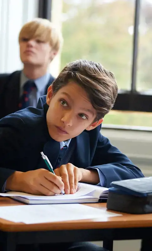 Senior school pupil studying in class