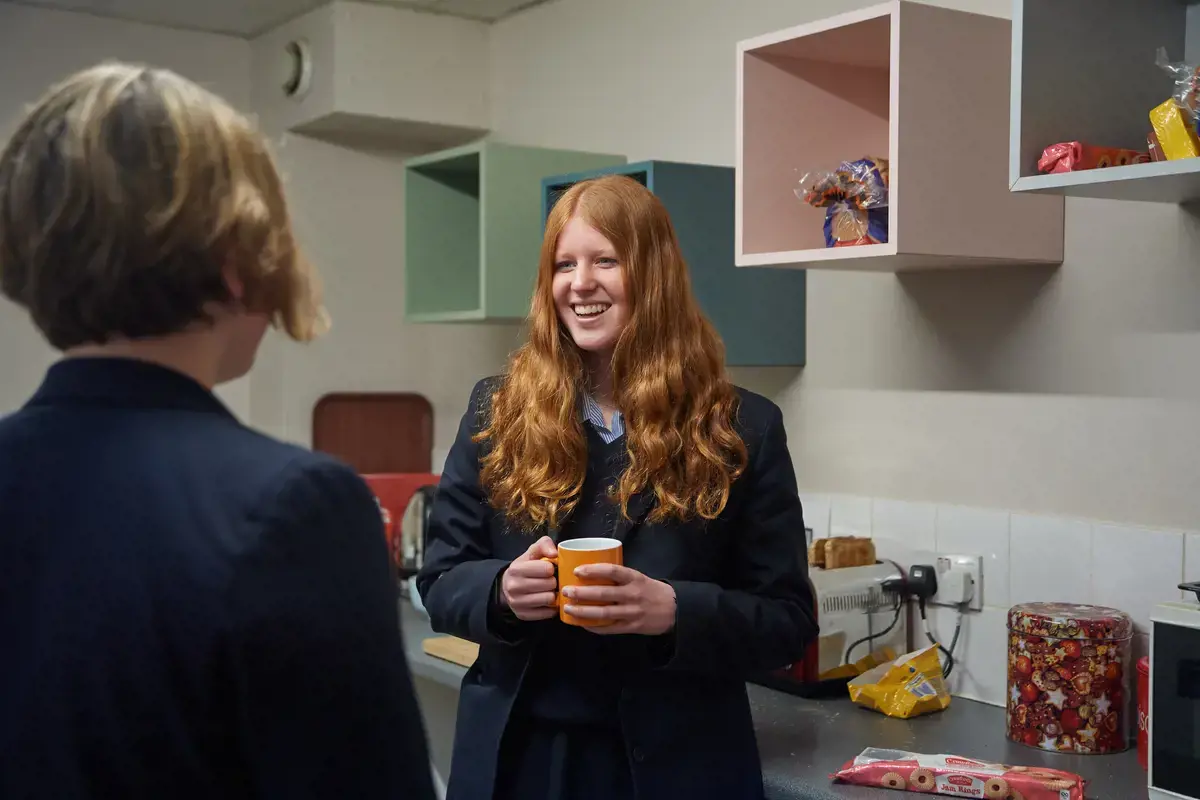 Students enjoying a chat and a hot drink